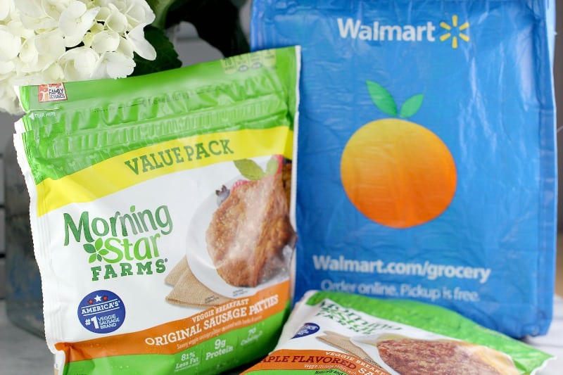 packaged Morningstar Breakfast patty value pack and Morningstar Farms maple sausage pack next to blue disposable Walmart shopping bag