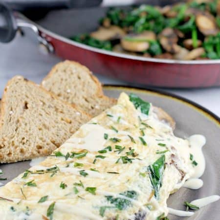 Healthy and satisfying, this egg white omelet with vegetarian sausage, spinach, and mushroom, will satisfy you breakfast, lunch or dinner. If you have goals this year and want to eat better to get there, this recipe is for you.