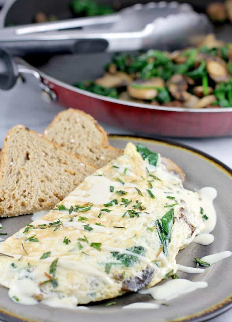 This healthier egg white omelet with vegetarian sausage, spinach, and mushroom, will satisfy you breakfast, lunch or dinner.