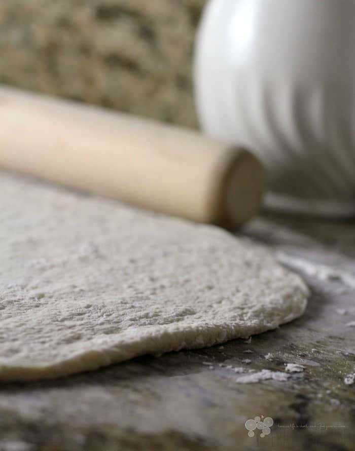 raw dough rolled out on counter