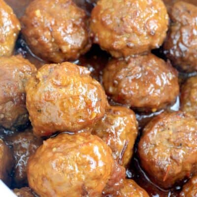 angled down view of the saucy meatballs in a white crockpot