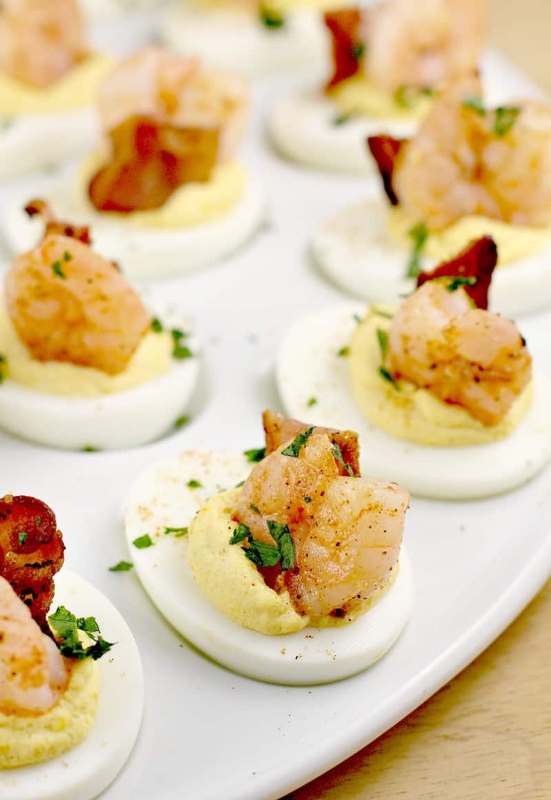 fully assembled shrimp deviled eggs on a white platter