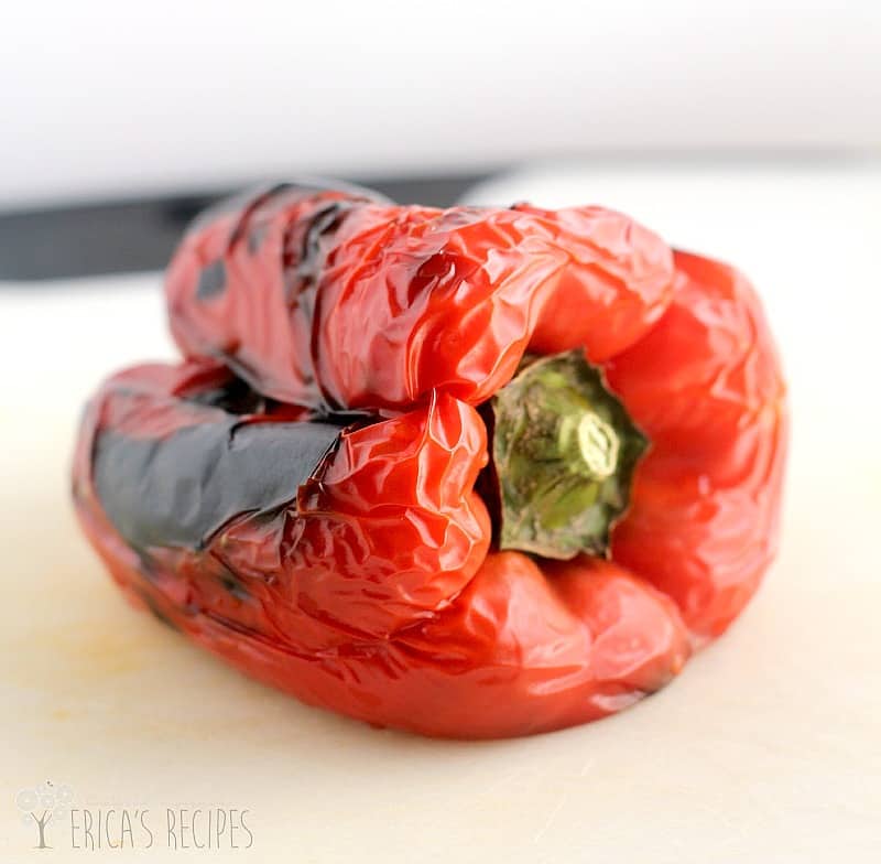 a freshly roasted red bell pepper showing the black blistered skin