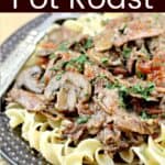 Image for Pinterest with text overlay Cajun Instant Pot Pot Roast, finished recipe plated
