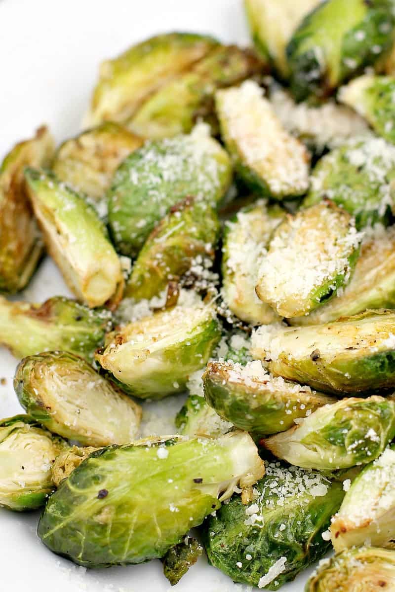 close in view of the finished sprouts topped with parmesan