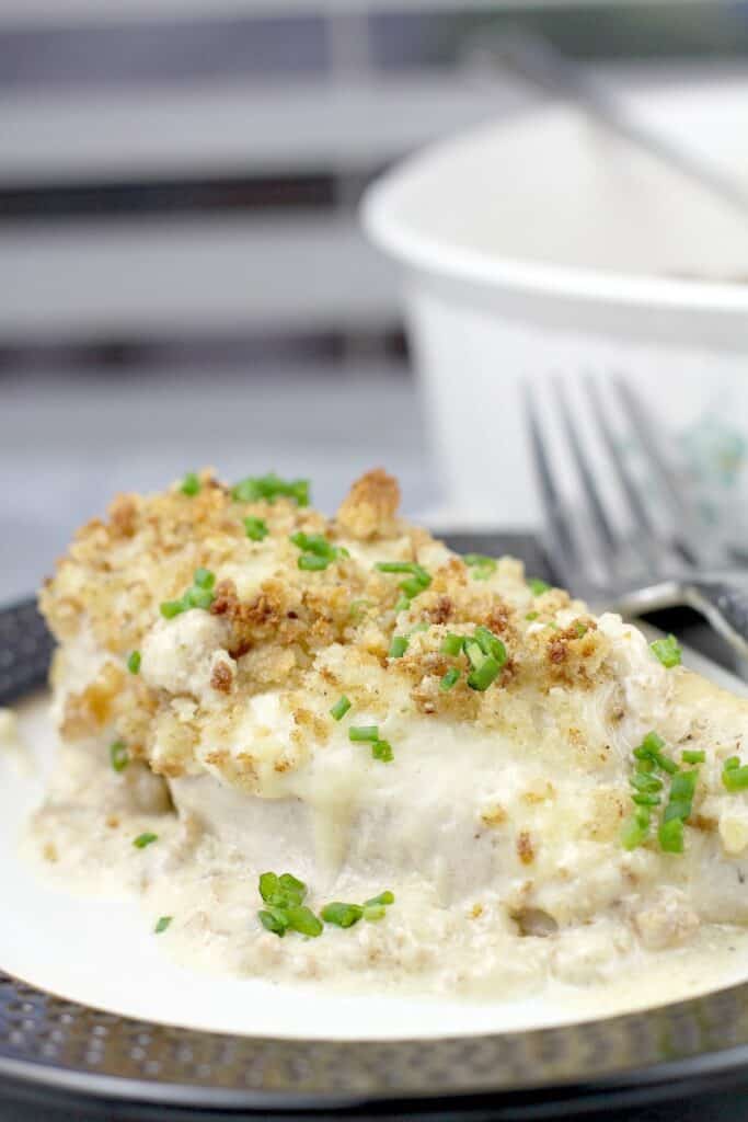 chicken breast on a plate with a fork