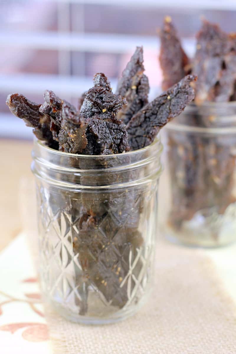 teriyaki jerky filling a mason jar