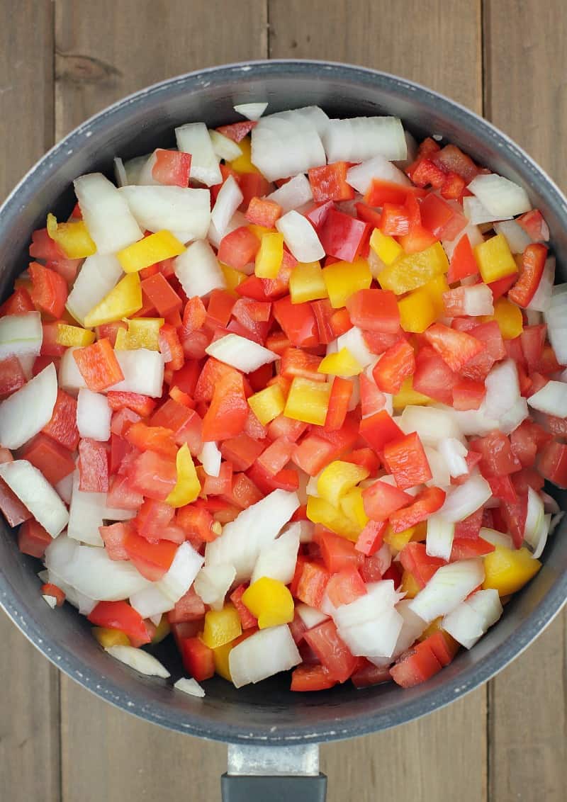 chopped relish ingredients in a black saucepan prior to cooking