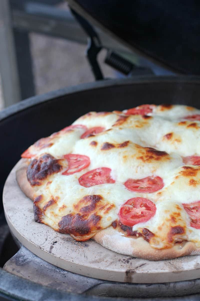 cooked pizza on the grill