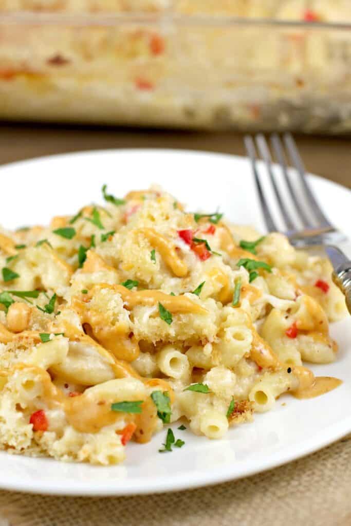 crab mac and cheese on white plate with fork