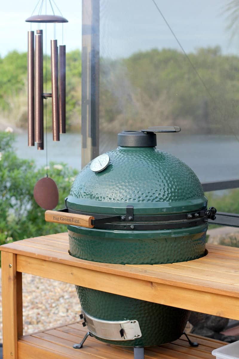 size large big green egg in a table outdoors