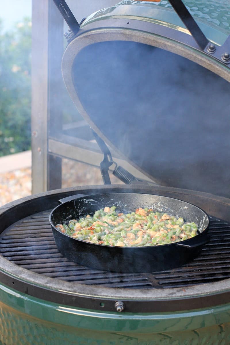 cast iron skillet on grill grate in big green egg