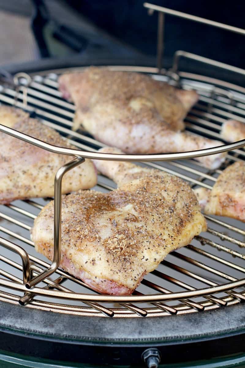 raw chicken on grill grate