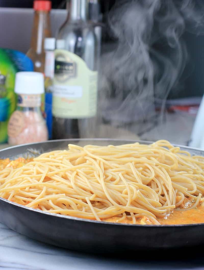 spaghetti steaming in a skillet