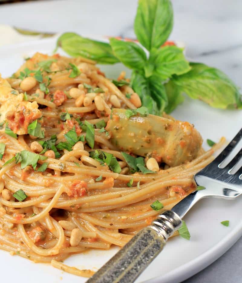 plated pasta on a white plate with a fork