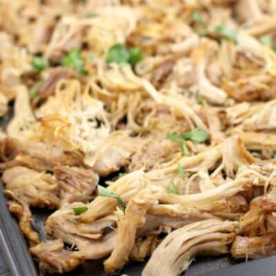 shredded chicken carnitas on a bake sheet