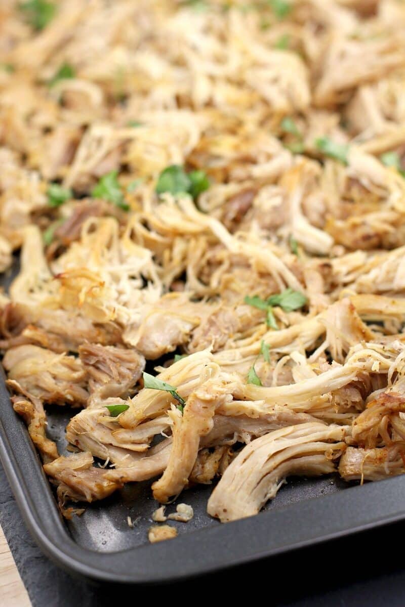 shredded chicken carnitas on a bake sheet