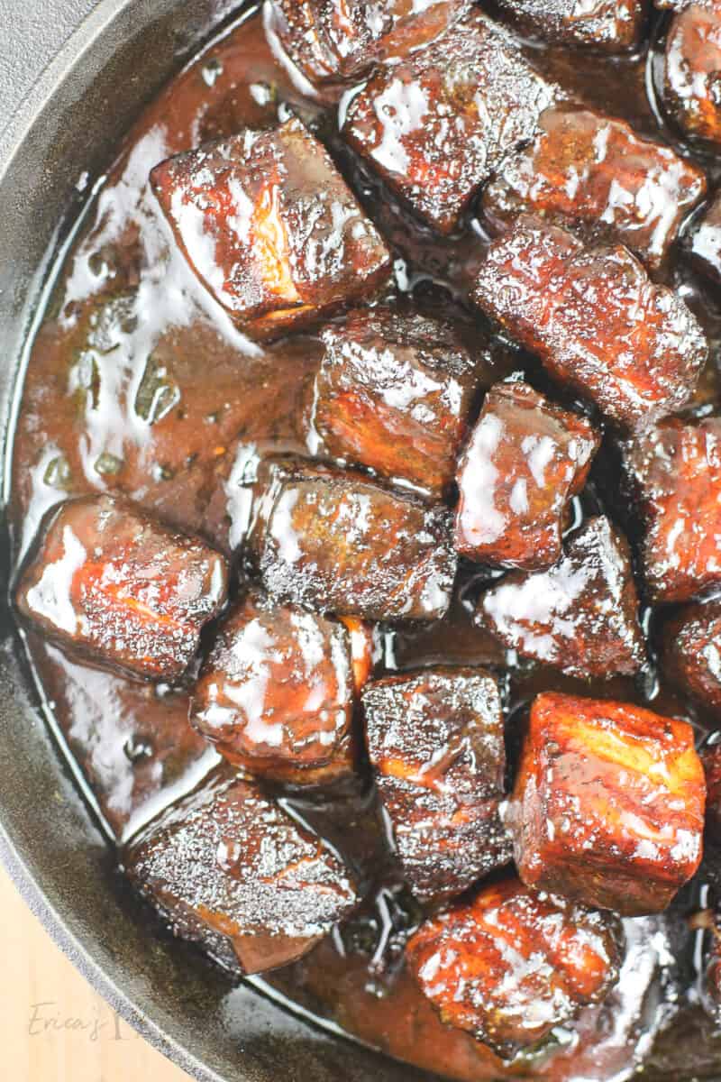 glazed pork belly burnt ends in black pan