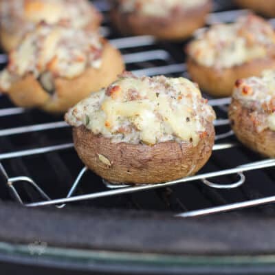 grilled stuffed mushroom on grate in big green egg grill