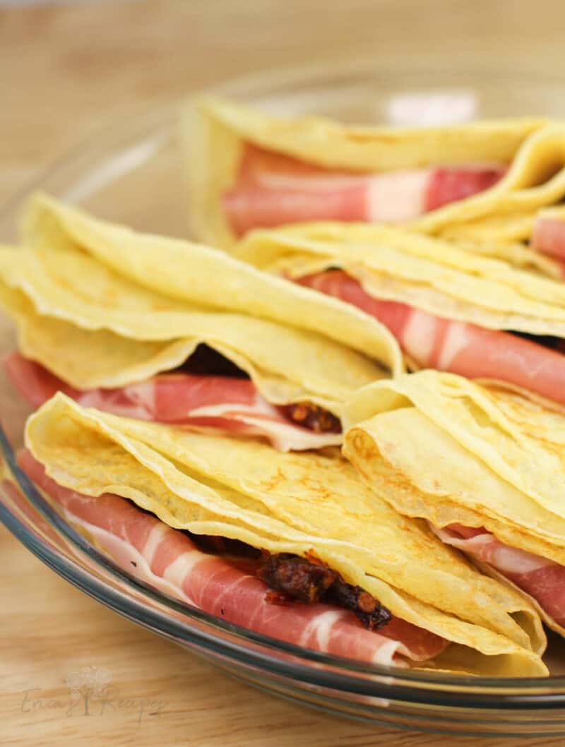 folded crepes in clear glass plate