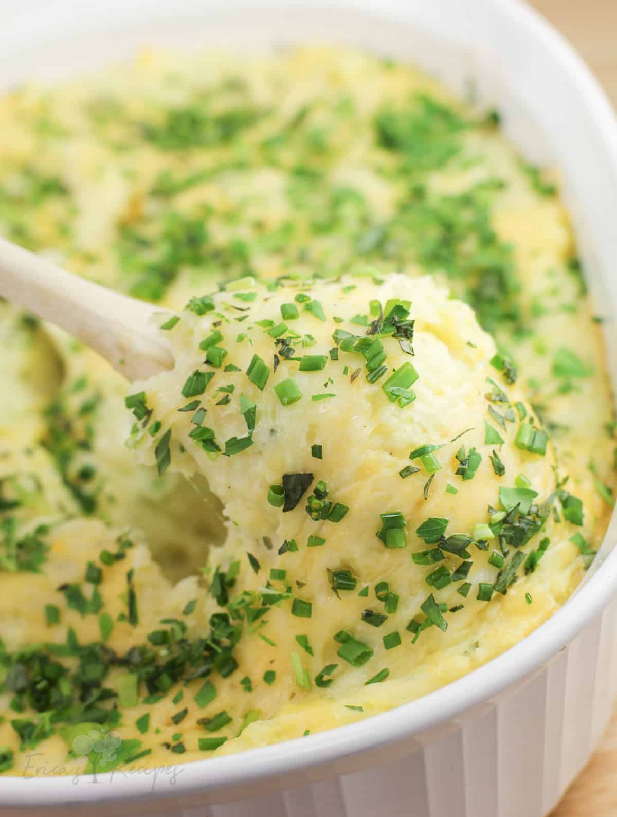 spoon lifting cooked mashed potatoes