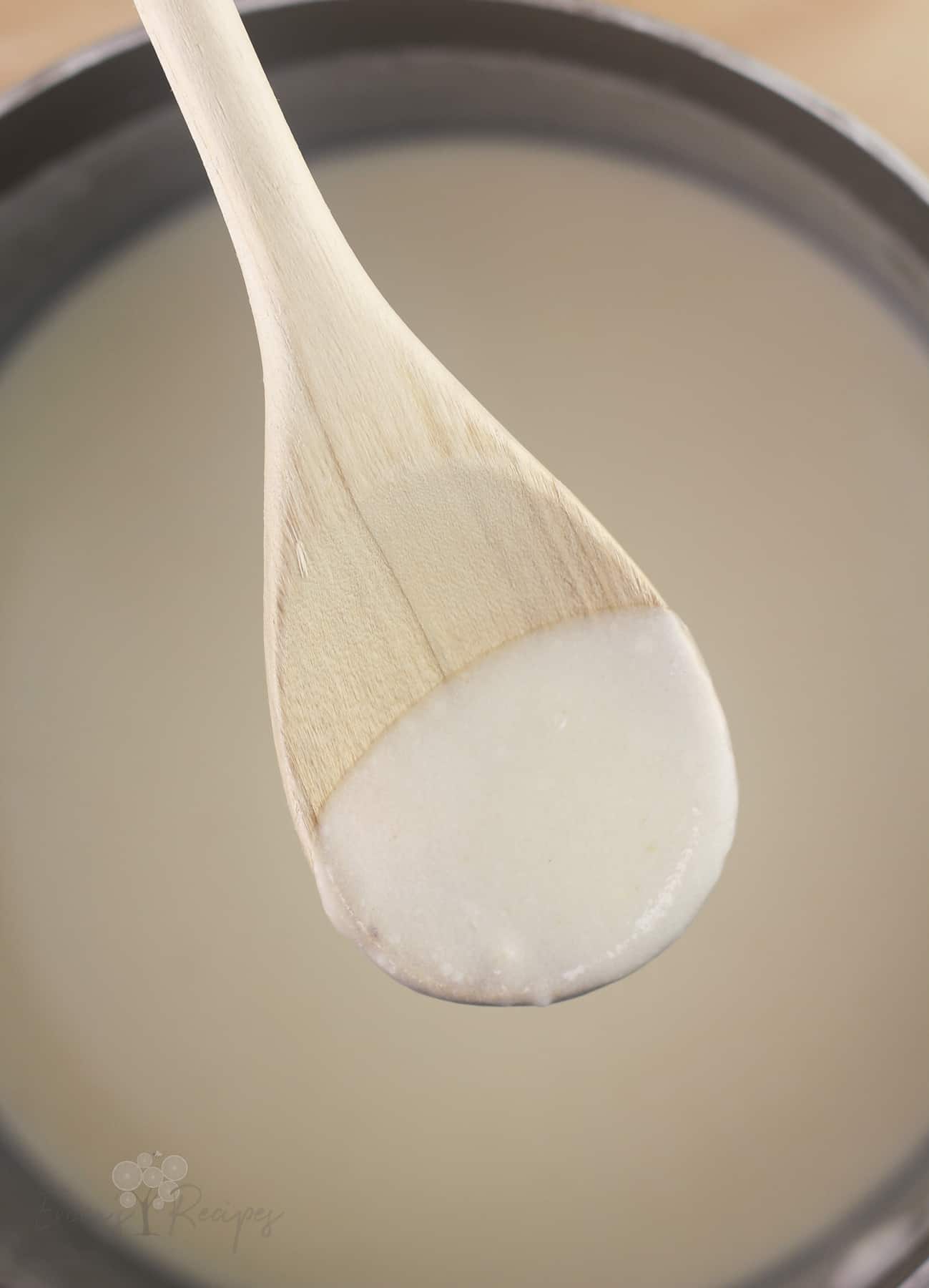 wood spoon with sauce to show thickness