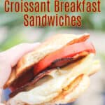 image of prepared recipe for Pinterest with text overlay recipe title Blackstone Croissant Breakfast Sandwiches