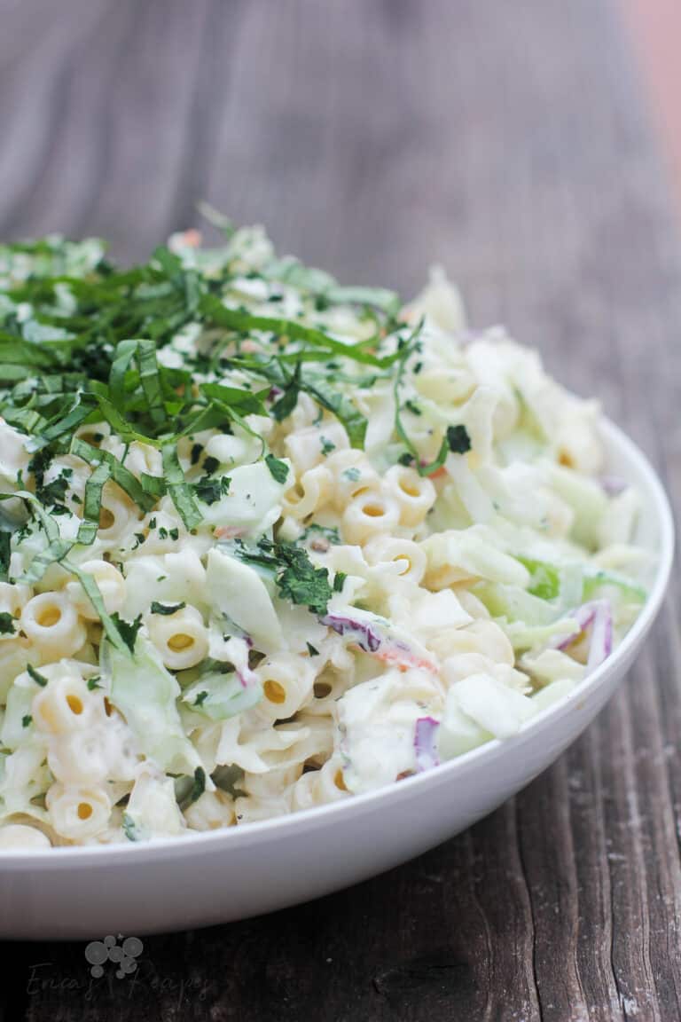 coleslaw pasta salad in white bowl, side view