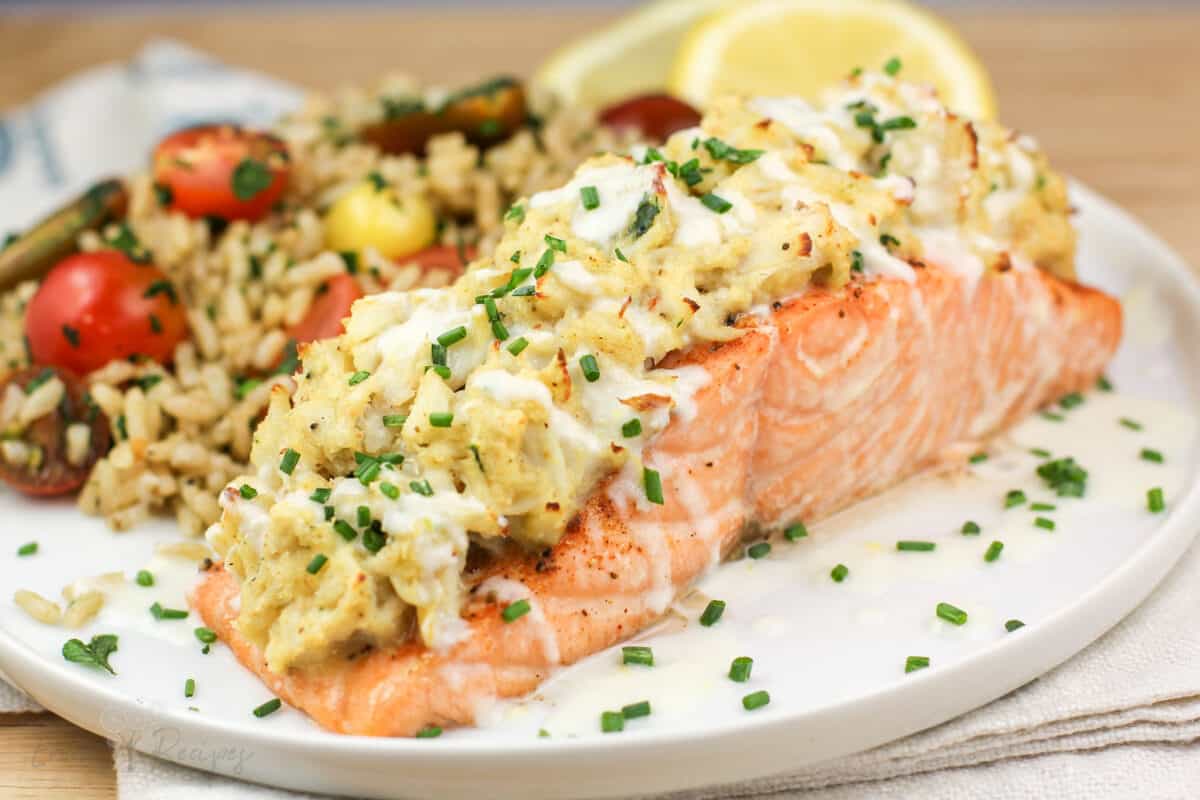 side view assembled stuffed salmon on white plate