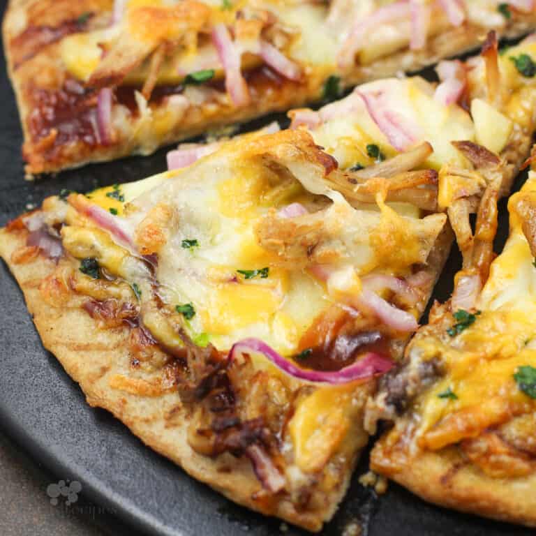 slice of pizza on black pizza stone.