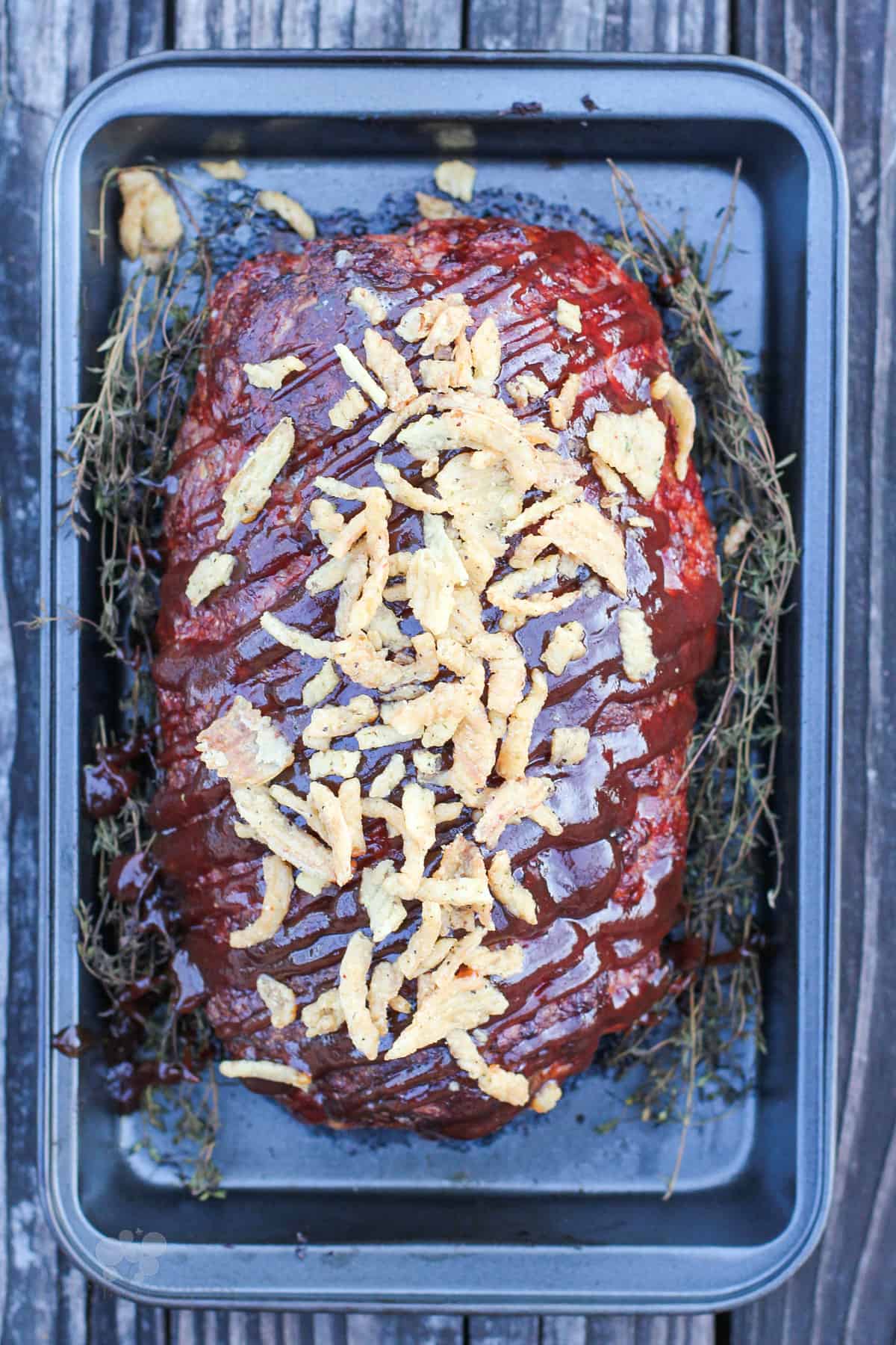 top down view of prepared meatloaf with bbq sauce on top