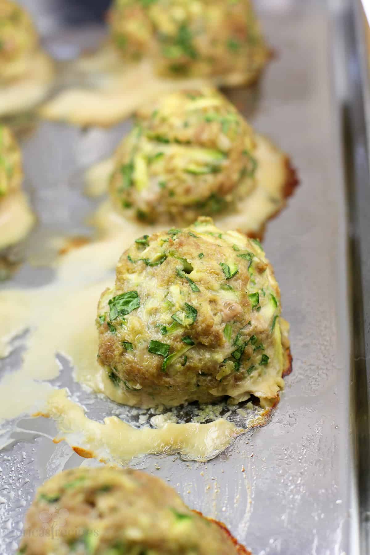 cooked meatball on bake sheet