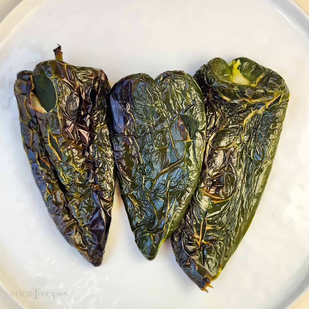 roasted poblano peppers on white surface