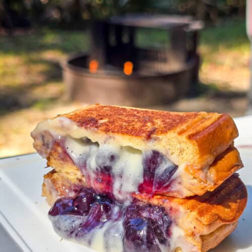 cross-section of blueberry brulee hand pie showing the toasty bread and creamy fillings